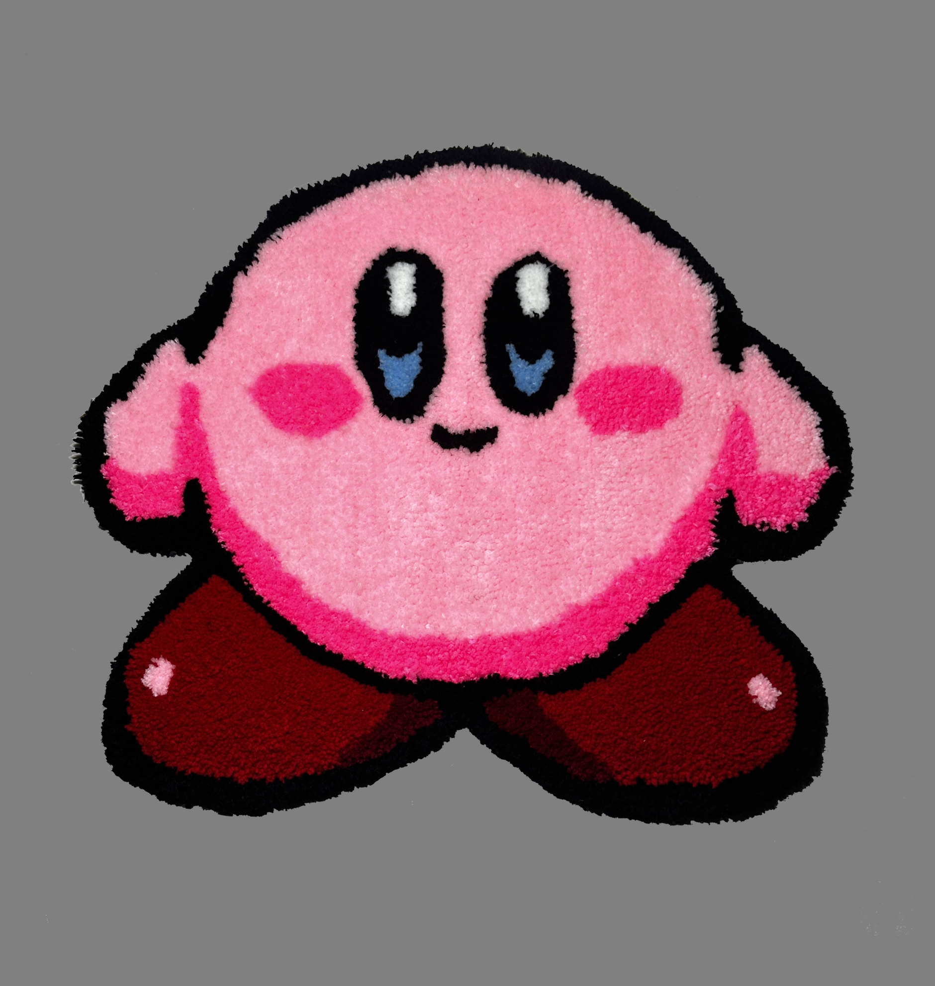 Pink and brown character patch on a gray background